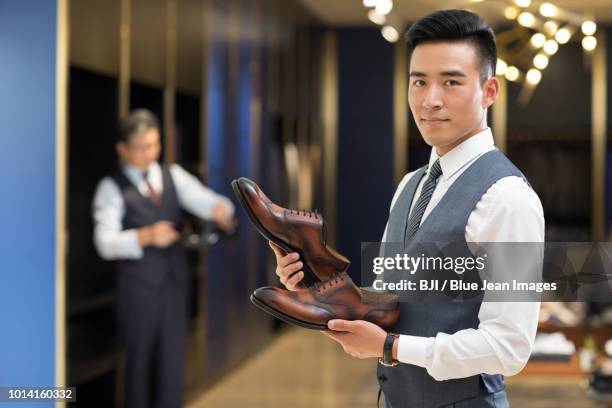 businessman choosing leather shoes - young choice beijing activity stock pictures, royalty-free photos & images