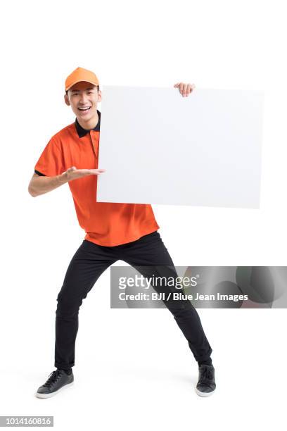 cheerful pizza delivery person showing a whiteboard - delivery person on white stock pictures, royalty-free photos & images