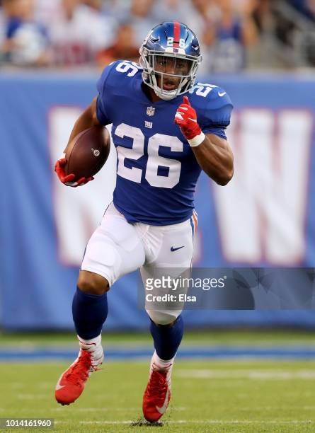 Saquon Barkley of the New York Giants carries the bal in the first quarter against the Cleveland Browns during their preseason game on August 9,2018...