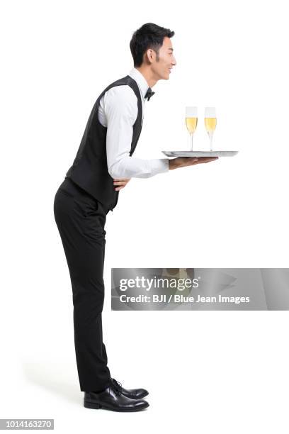 young waiter with champagne - kellner tablett stock-fotos und bilder