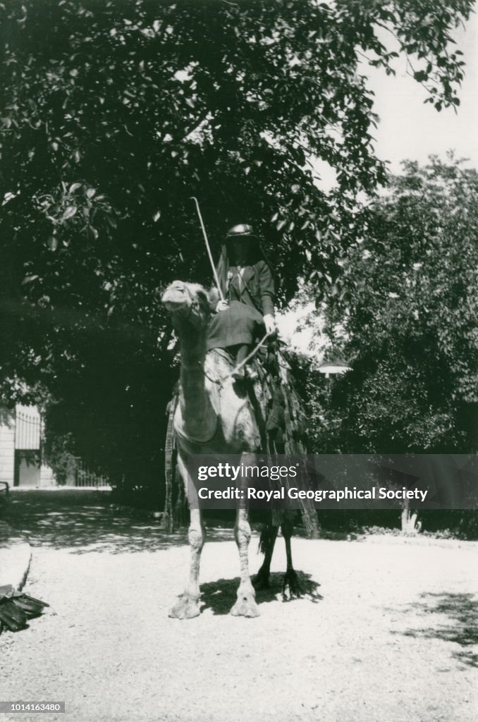 Gertrude Bell sitting on a camel