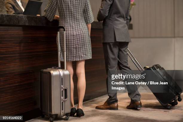 couple checking into hotel - vip reception stock pictures, royalty-free photos & images