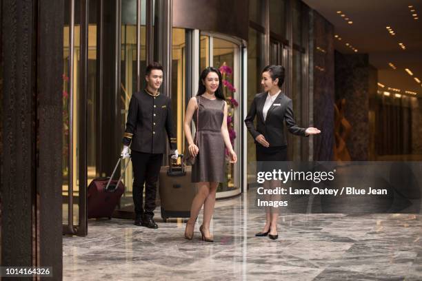 professional service in luxury hotel - porter stock pictures, royalty-free photos & images