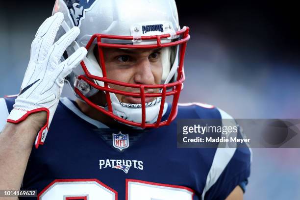 Rob Gronkowski of the New England Patriots looks on before the preseason game between the New England Patriots and the Washington Redskins at...
