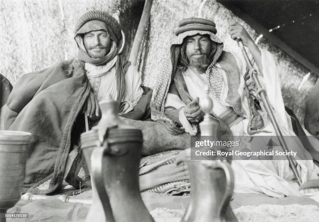 Two tribesmen in a tent at the encampment of Shaikh Auda Abu Tayyi of the Huwaitat