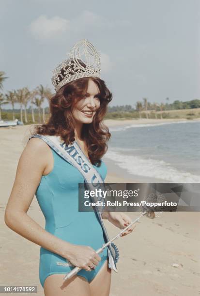 Winner of the Miss Universe 1972 pageant, Kerry Anne Wells of Australia, pictured wearing a blue bathing costume and the winner's crown and sash on...