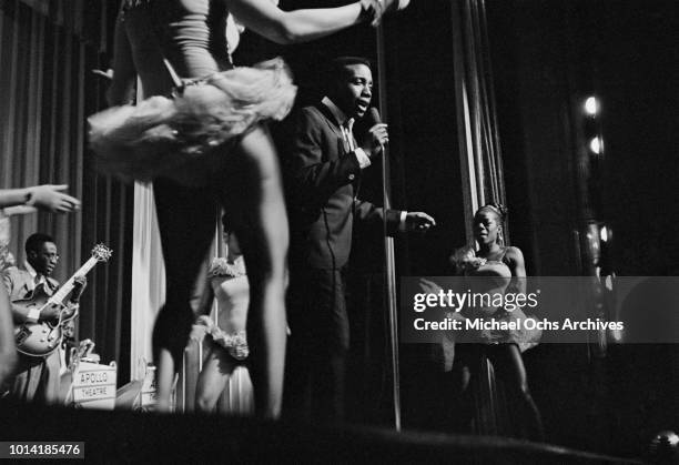 American soul singer Jerry Butler performs with Betty Everett and The Impressions at the Apollo Theatre, New York City, circa 1965.