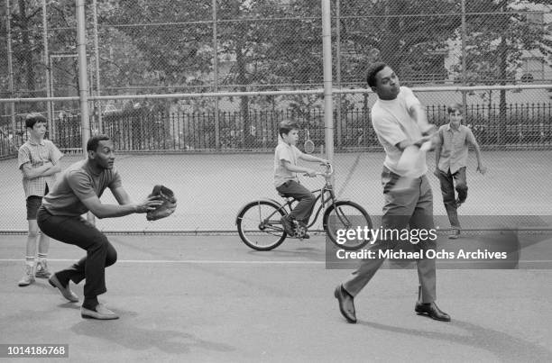 Singers Abdul 'Duke' Fakir and Renaldo 'Obie' Benson of American vocal group the Four Tops take part in a sports event in New York City, 1965.