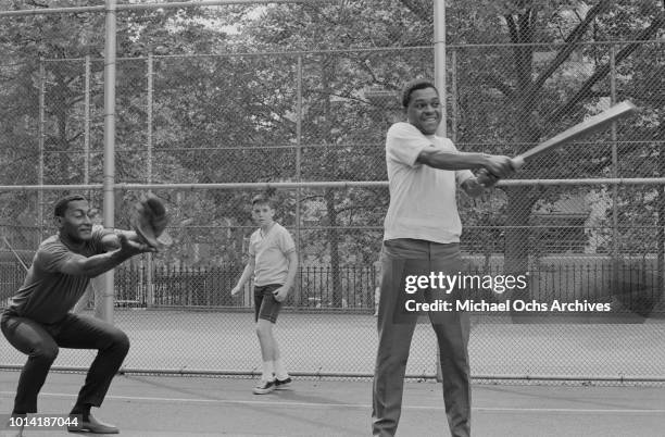 Singers Abdul 'Duke' Fakir and Renaldo 'Obie' Benson of American vocal group the Four Tops take part in a sports event in New York City, 1965.