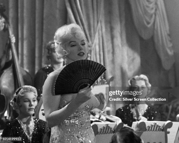 American actress Marilyn Monroe performs a musical number in a scene from the comedy 'Some Like It Hot', 1959.