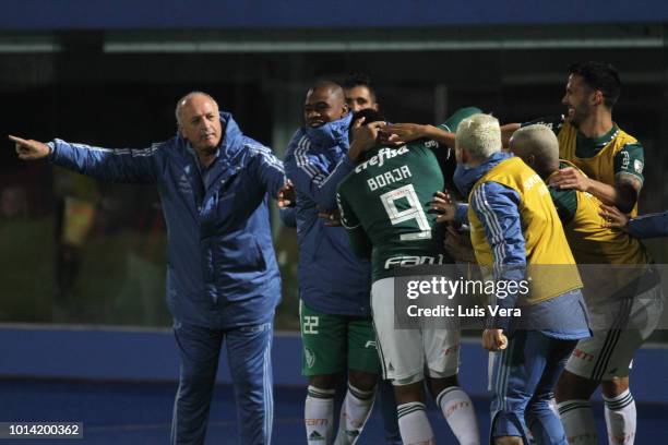 Miguel Borja of Palmeiras celebrates with teammates after scoring the first goal of his team during a round of sixteen match between Cerro Porteno...