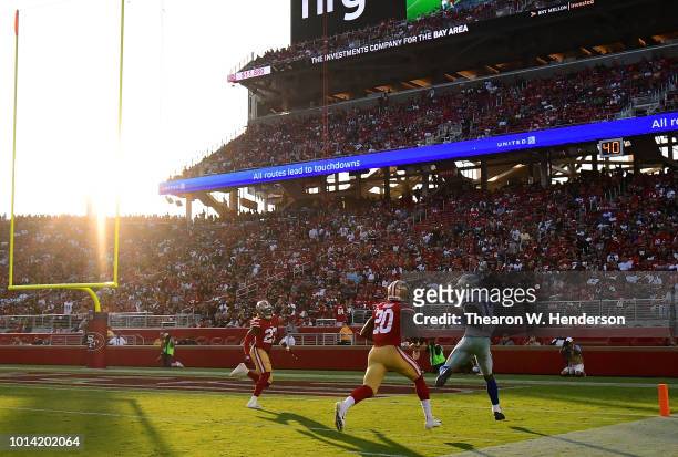 Michael Gallup of the Dallas Cowboys catches a touchdown pass over Jimmie Ward of the San Francisco 49ers in the first quarter of their NFL preseason...