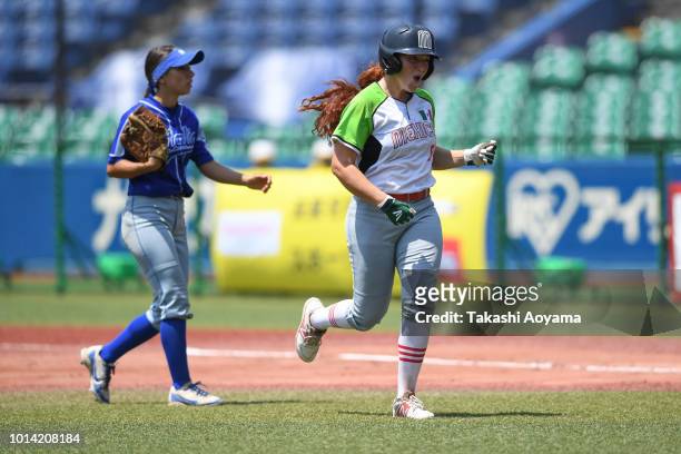 Suzannah Lillian Brookshire Gonzalez of Mexico celebrates with team mates after hitting the game winning RBI single in tiebreak against Italy during...