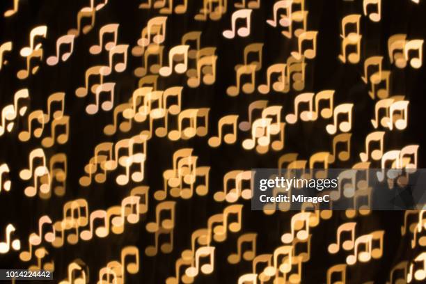 musical note shape bokeh backdrop - muzieksymbool stockfoto's en -beelden