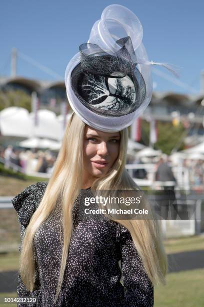 Stylish racegoer Joanna Borov, from Poland, wearing blue dress and fascinator in Parade Ring Area, 'Ladies Day' at "Glorious Goodwood" - The Qatar...