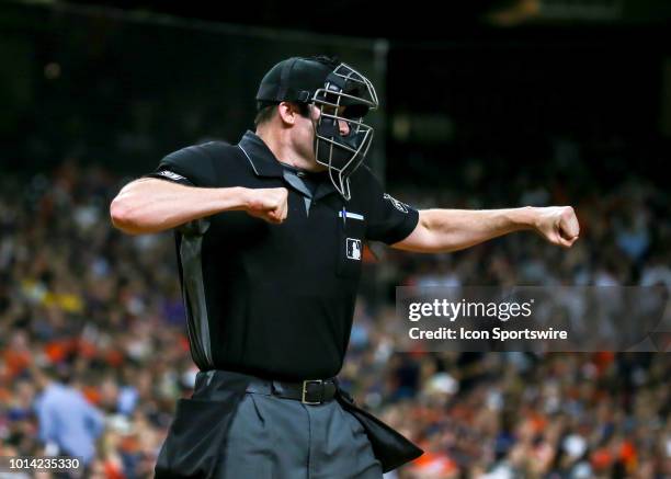 Umpire Nic Lentz calls a strike out on Seattle Mariners catcher Mike Zunino in the top of the third inning during the baseball game between the...