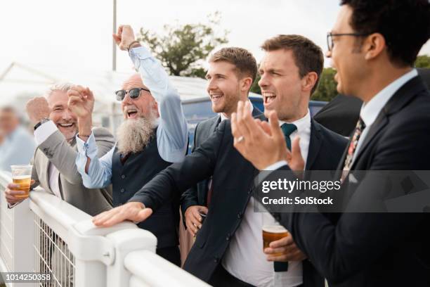 friends celebrating at the races - british upper class stock pictures, royalty-free photos & images