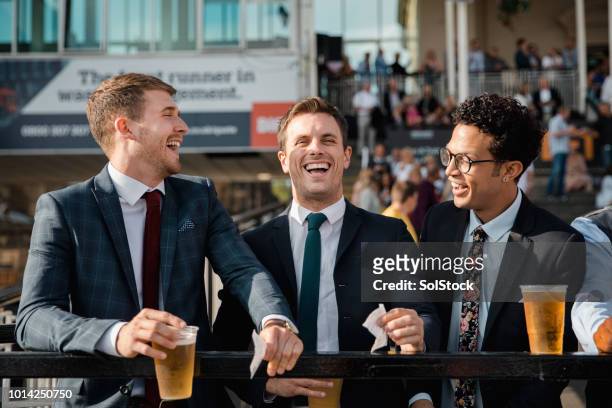 friends enjoying the races - beer luxury stock pictures, royalty-free photos & images