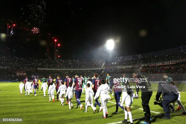 Players of Cerro Porteño and Palmeiras get in the field prior a round of sixteen match between Cerro Porteno and Palmeiras as part of Copa CONMEBOL...