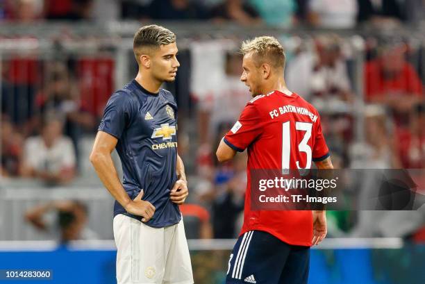 Andreas Pereira of Manchester United speaks with Rafinha of Bayern Muenchen during the friendly match between Bayern Muenchen and Manchester United...