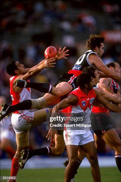 Darryl Wakelin of St Kilda jumps highest but Adam Goodes of Sydney catches the ball during the AFL Round 11match played at Waverley Park in...