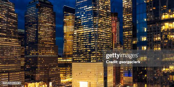 illuminated skyscrapers at dusk - great american group stock pictures, royalty-free photos & images
