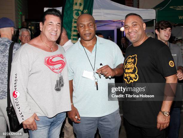 Mike Tyson and Russell Peters attend the Athletes vs Cancer Smoke4aCure Event on August 9, 2018 in Inglewood, California.