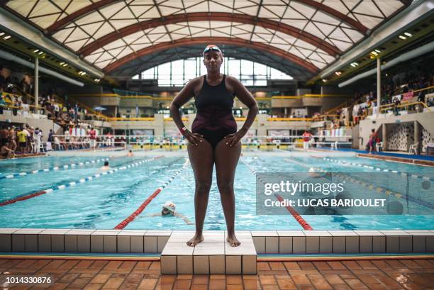 Ugandan swimmer Clare Byarugaba poses during the swimming competition at the 2018 Gay Games edition at The Georges-Vallerey swimming pool in Paris on...