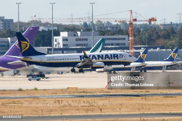 An airplane of discount airliner RyanAir lands during a 24-hour strike by the pilots while other stand at the Frankfurt Airport on August 10, 2018 in...