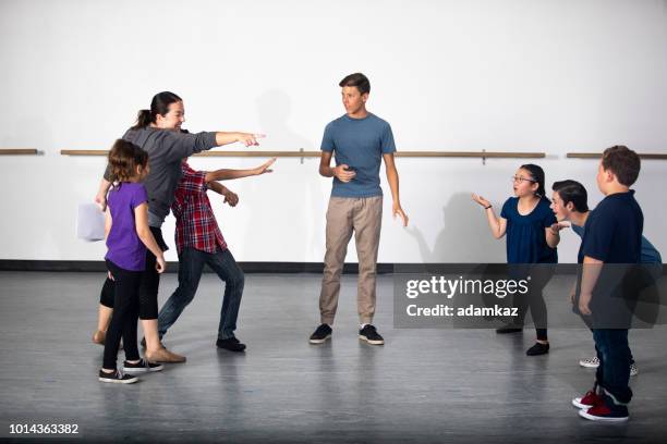 diverse group of drama students receive instruction from director - high school for the performing and visual arts stock pictures, royalty-free photos & images
