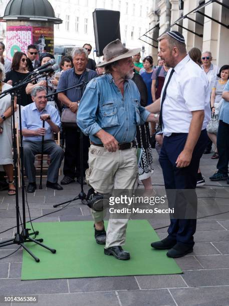 German Artist Gunter Demnig and Robert Waltl of the Jewish Cultural Centre Ljubljana during speaches ahead of the ceremony to lay a block...