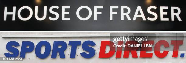 Combination of photographs created in London on August 10, 2018 shows the logos of retailer House of Fraser and Sports Direct on the front of London...