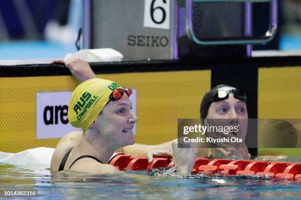 Cate Campbell of Australia celebrates winning the gold medal with bronze medalist Taylor Ruck of Canada after competing in the Women's 100m Freestyle...
