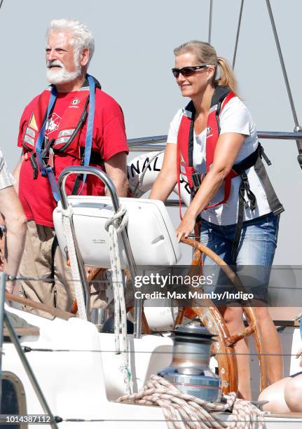 Sophie, Countess of Wessex seen at the helm of 'Donald Searle' an Ocean 75ft Ketch Yacht during an Association of Sail Training Organisations sailing...