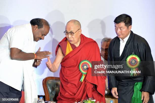 Tibetan spiritual leader the Dalai Lama greets Karnataka Chief Minister, H.D. Kumaraswamy while President of Central Tibetan Administration, Lobsang...