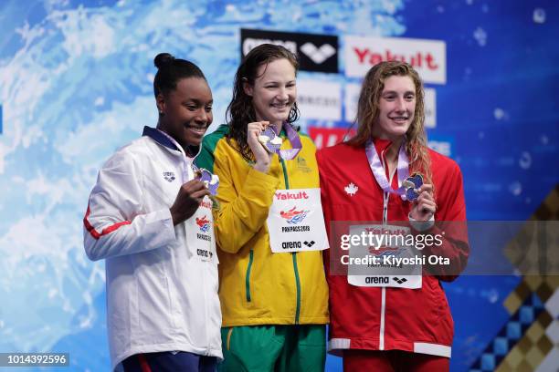 Silver medalist Simone Manuel of the United States, gold medalist Cate Campbell of Australia and bronze medalist Taylor Ruck of Canada celebrate on...