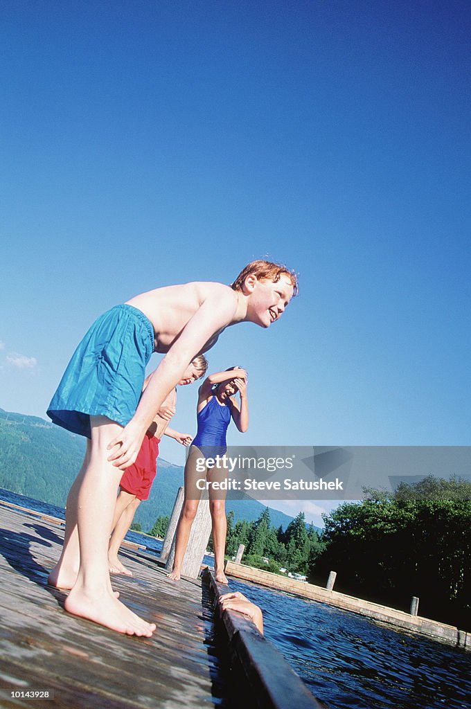 KIDS PLAYING ON DOCK, LAKE WHATCOM, WASHINGTON