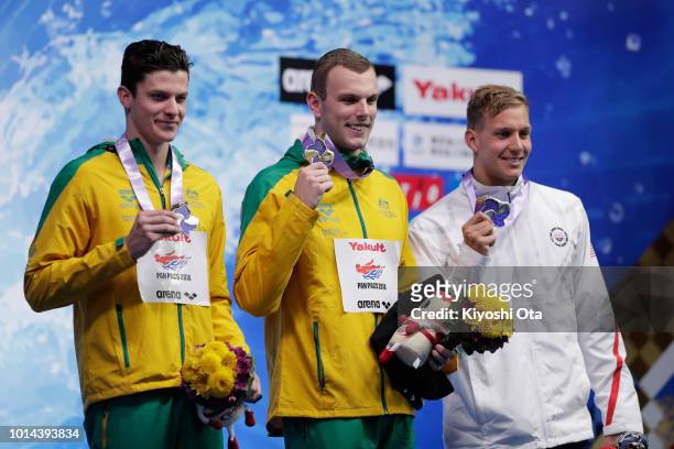 Gold medalist Kyle Chalmers of Australia, joint silver medalists Jack Cartwright of Australia and Caeleb Dressel of the United States pose on the...