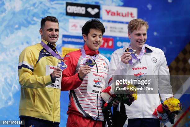 Silver medalist Leonardo De Deus of Brazil, gold medalist Daiya Seto of Japan and bronze medalist Zachary Harting of the United States celebrate on...