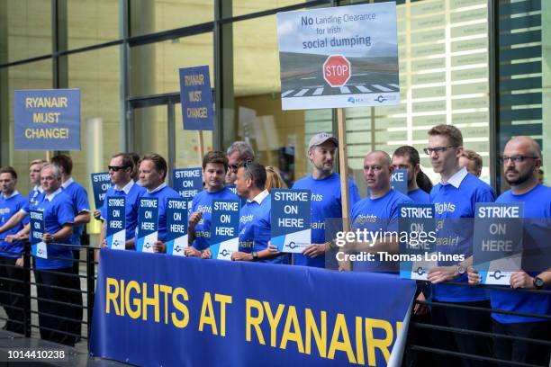 Pilots of discount airliner RyanAir gather at the headquarters of the pilots' labor union Vereinigung Cockpit during a 24-hour strike by the pilots...