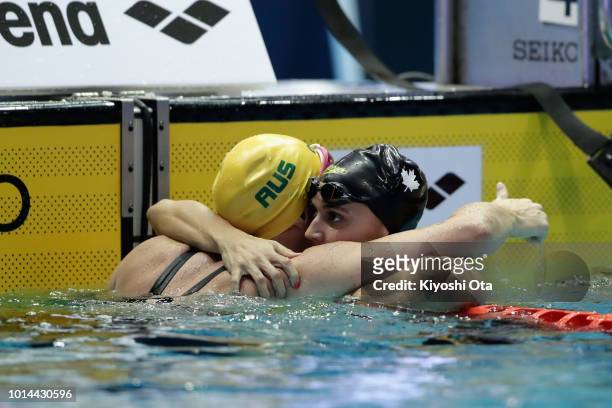 Kylie Masse of Canada is congratulated after winning the gold medal by silver medalist Emily Seebohm of Australia in the Women's 200m Backstroke...