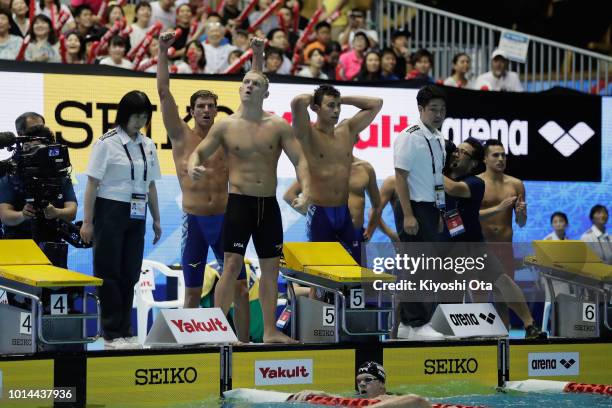 Team United States celebrate winning the gold medal in the Men's 4x200m Freestyle Relay on day two of the Pan Pacific Swimming Championships at Tokyo...