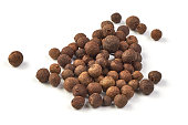 Whole allspice, isolated on white background. Aromatic allspice.