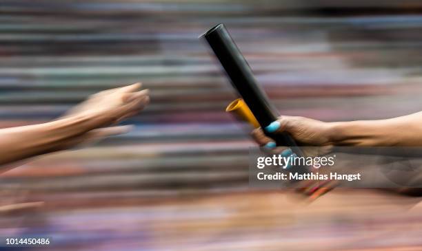 Detailed view of a baton exchange in the Women's 4x400 metres relay heats during day four of the 24th European Athletics Championships at...