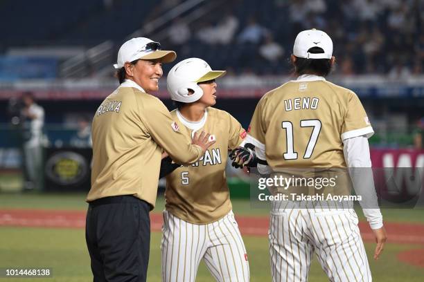 Yu Yamamoto of Japan celebrates after hitting a grand slam in the second inning against Puerto Rico during their Playoff Round at ZOZO Marine Stadium...