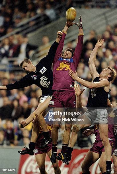 Darryl White of the Brisbane Lions catches above the Carlton Blues defence during the AFL Second Qualifying Final at the Gabba in Brisbane,...