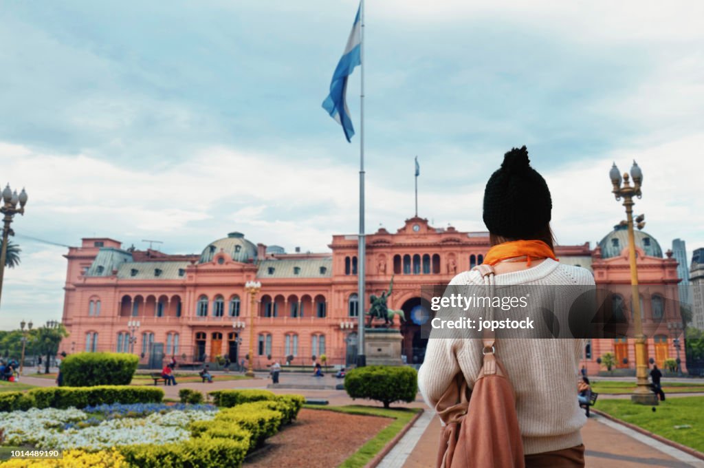 Young Woman walking at Plaza de Mayo Square in Buenos Aires, Argentina