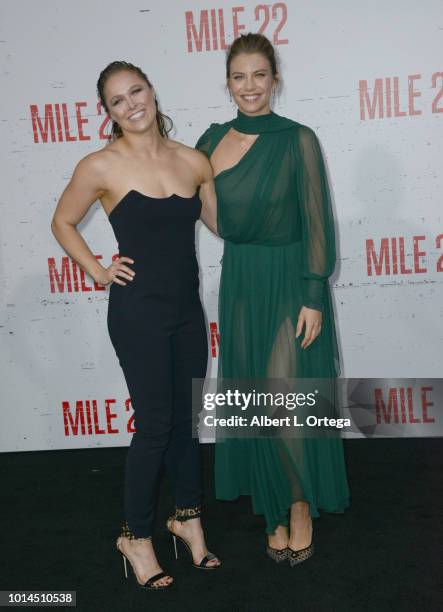 Actresses Ronda Rousey and Lauren Cohan arrive for the Premiere Of STX Films' "Mile 22" held at Westwood Village Theatre on August 9, 2018 in...