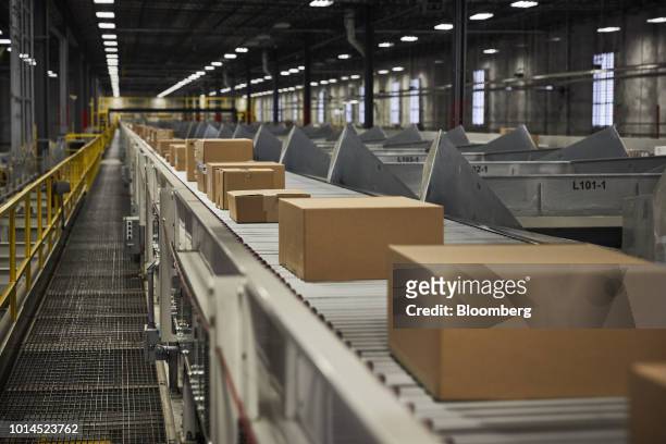 Packages move along a conveyor belt at the FedEx Corp. Ground distribution center in Jersey City, New Jersey, U.S., on Tuesday, Aug. 7, 2018. FedEx...