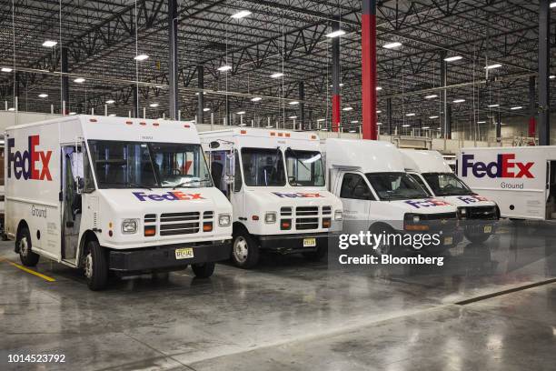 Delivery trucks sit parked at the FedEx Corp. Ground distribution center in Jersey City, New Jersey, U.S., on Tuesday, Aug. 7, 2018. FedEx is heading...